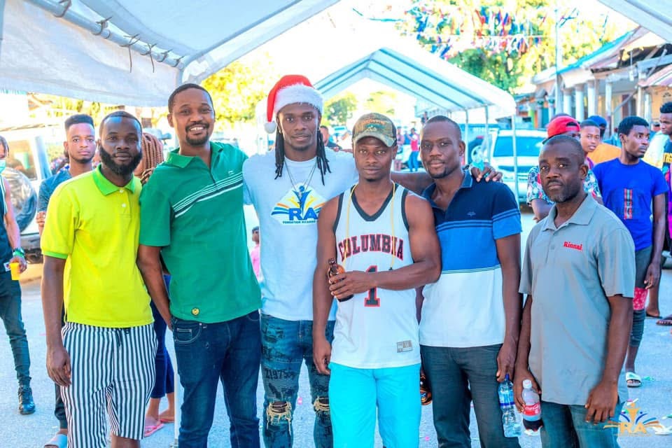 Foundation team members together at a holiday community event in Haiti